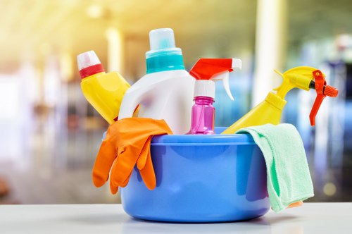 Professional using protective gear during carpet cleaning