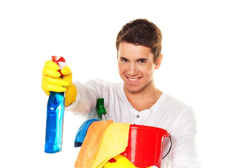 Technician using PPE during carpet cleaning in West Hendon